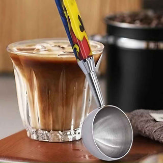 Brewmaster Coffee Scoop Kits. Small Chrome Next to a glass of brewed  iced coffee