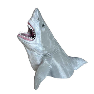 Shark model pen holder with open mouth on a white background