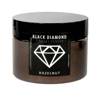 Jar of Black Diamond pigment powder with hazelnut flavor on a white background