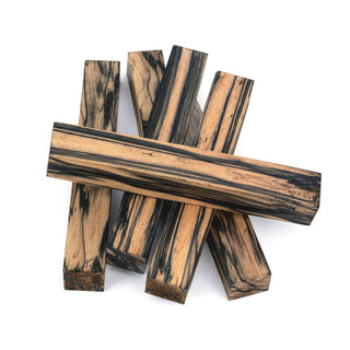 Five Black & White Ebony pen blanks showcasing bold black and cream grain patterns for custom pen turning projects