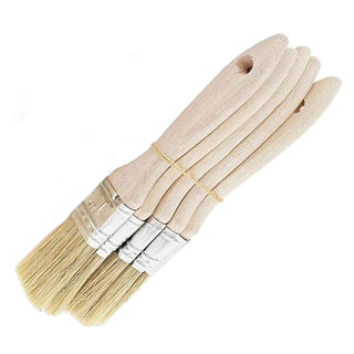 Set of five paint brushes with wooden handles on a white background