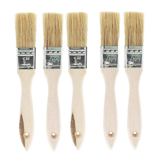 Set of five paint brushes with wooden handles and metal ferrules on a white background