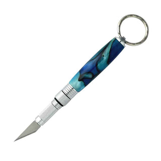 Hobby knife keychain kit with #11 blade and flip-close mechanism. Chrome