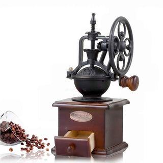 Vintage-style coffee grinder with coffee beans on a white background