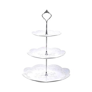 Three-tiered decorative stand with ornate design on a white background