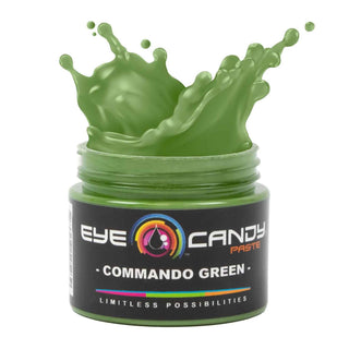 Green jar of Eye Candy Paste with splashing green substance on a white background