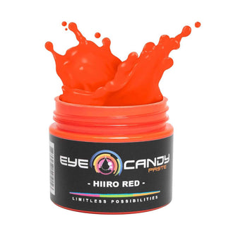 Jar of Eye Candy Paste in Hiro Red with a splash on a white background