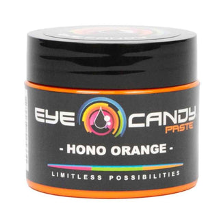 Black container of Eye Candy Paste Hono Orange on a white background