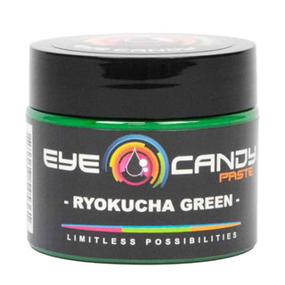 Black container of Eye Candy Paste Ryokucha Green on a white background