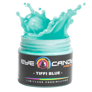 Jar of Eye Candy Paste Tiffi Blue with a splash effect on a white background