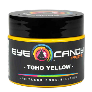 Black container of Eye Candy Paste Toho Yellow on a white background