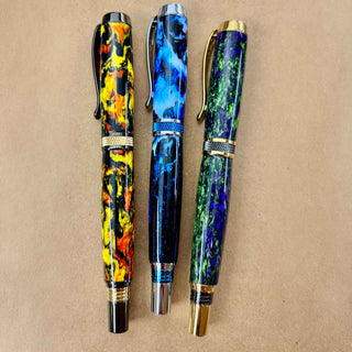 Midnight Apparitions Hocus Pocus and Wicthes Brew Alumilite pen blanks by John U turned into custom rollerball pens. Alt Image