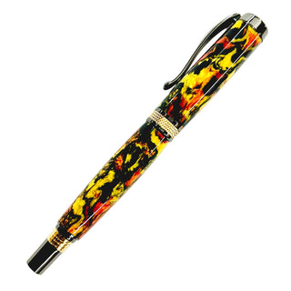 Hocus Pocus Alumilite pen blank by John U turned and polished on a Diamond Knurl rollerball pen showing orange yellow and black swirls
