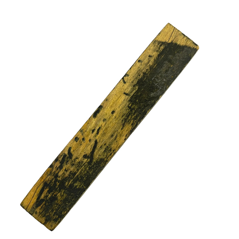 Wooden pen blank with black markings on a white background