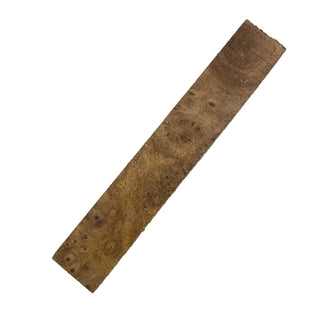 Rectangular piece of wood with a burl pattern on a white background