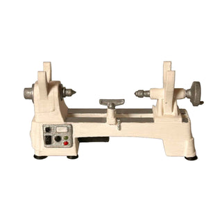 3D printed and hand‑painted miniature lathe pen holder used as a desk organizer. White