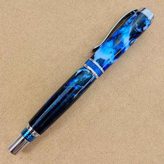 Midnight Apparitions Alumilite pen blank by John U turned into a custom rollerball pen with blue and black hardware