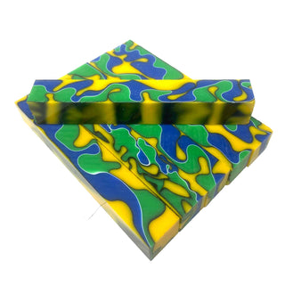 Lagoon acrylic pen blank with yellow, blue, and green swirl pattern and black and white ribbon accents. Group image