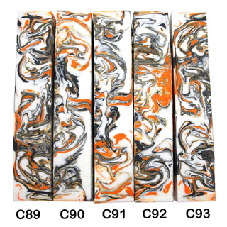 John Underhill handmade Alumilite pen blanks with black, orange and white swirl patterns. 89-93C