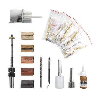 Complete Everything Except the Lathe Pen Turning Starter Set including five pen kits, pre-drilled blanks, mandrel, bushings, squaring jig, pen press, friction polish, and accessories.