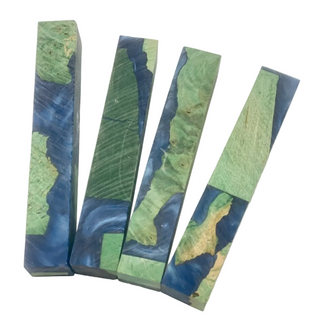 Four rectangular soap bars with green and blue natural pattern on a white background