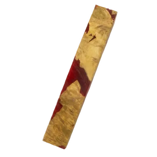 Wooden block with red and gold patterns on a white background
