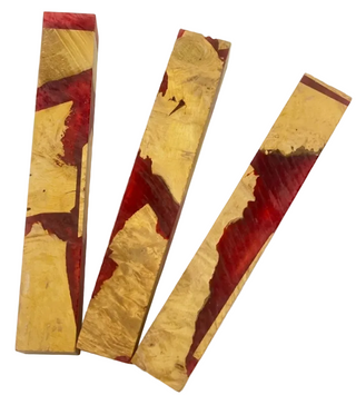 Three rectangular wooden planks with gold and red inlay on a white background