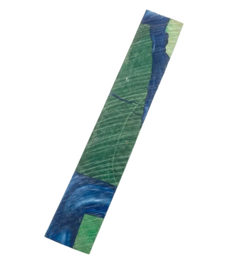 Roll of green and blue patterned paper on a white background