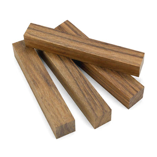 Shedua pen blanks with golden-brown color and dark contrasting grain patterns for custom pen turning and woodworking projects. Group of 4