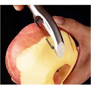 D-shaped heavy duty serrated vegetable peeler peeling an apple